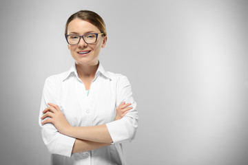 Young woman on grey background