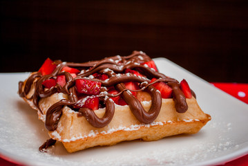 Belgian waffle with caramel and strawberry