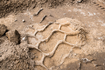tire mark on sand road