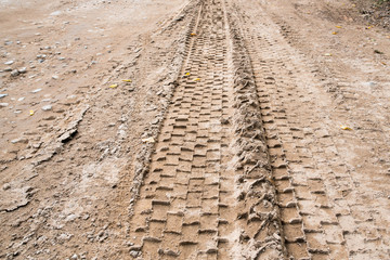 tire mark on sand road