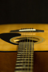 Fototapeta premium Acoustic guitar on black background