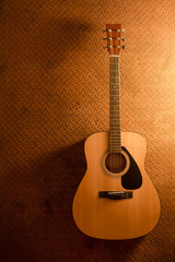 Acoustic guitar on old steel background with copy space