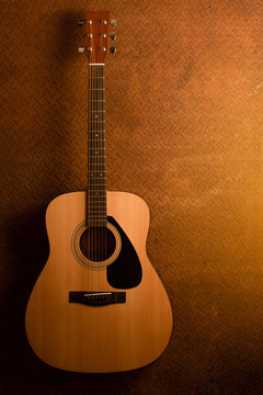 Acoustic guitar on old steel background