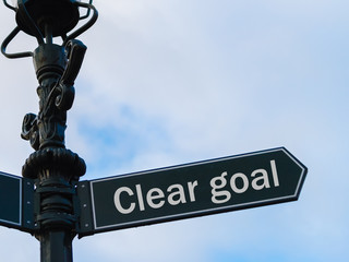 Clear Goal directional sign on guidepost