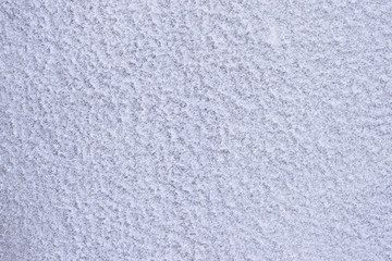 crystalline structure of the frozen snow on the wall.