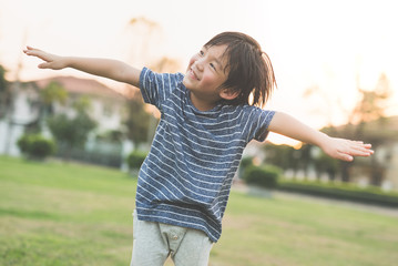 Asian child playing pilot aviator