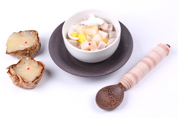 Nian gao dumplings and taro in coconut cream.