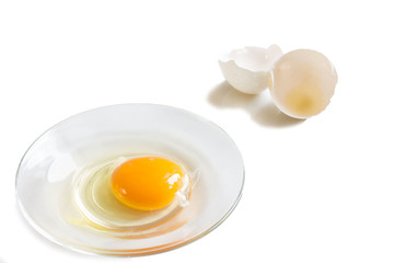 fresh homemade broken egg on a saucer with a cover