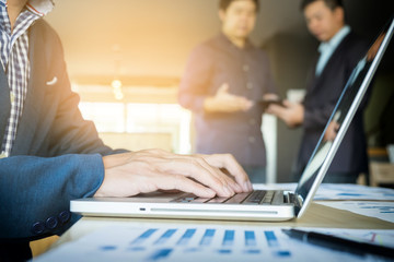Fototapeta premium working on laptop, close up of hands of business man