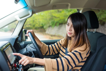 Fototapeta na wymiar Woman using GPS system on car