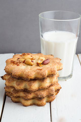 cookies with peanuts, a glass of milk on the table