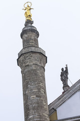 old church tower with a minaret close together