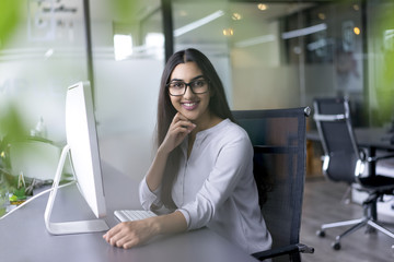 Portrait of smiling female executive in office