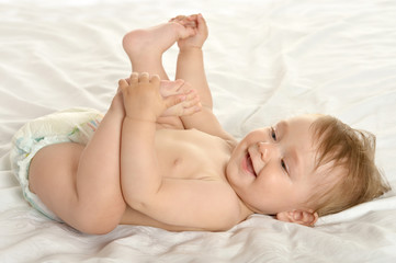 Baby girl lying in pampers