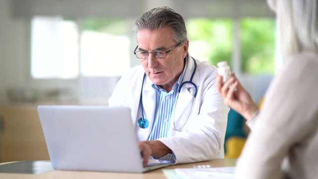 Patient at doctor's office receiving prescription