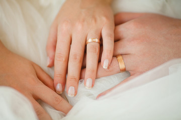 Wedding Rings on Couple Hands, Bridal White Dress