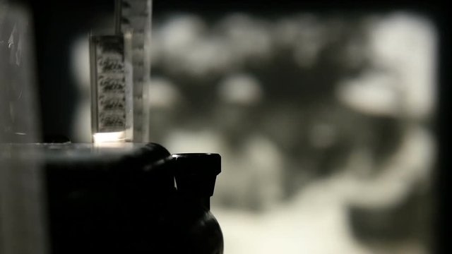 Moving of a black and white film strip in the blurred background with giraffe