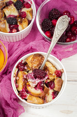 French toast casserole with cranberries, raspberries and blackbe