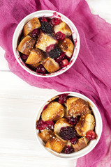 French toast casserole with cranberries, raspberries and blackbe
