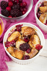 French toast casserole with cranberries, raspberries and blackbe