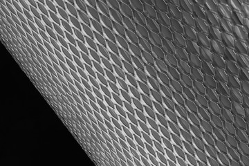mesh metal for filter in roll on a black background - obrazy, fototapety, plakaty