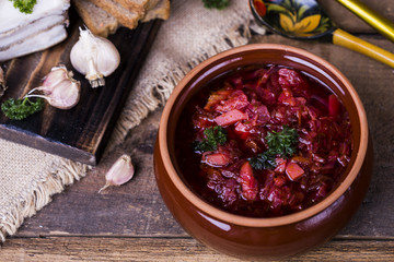 borsch soup and garlic on the table