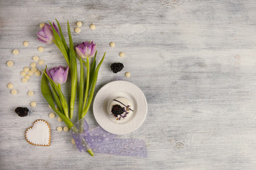 Cake and a bouquet of tulip, Valentines Day background.