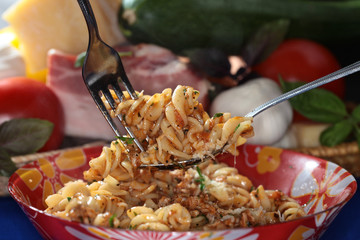 Fusilli pasta with cheese and sauce