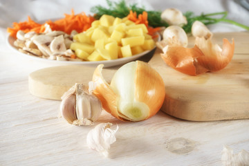 chopped onion and ingredients for soup