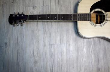 Fototapeta premium Acoustic guitar on wooden background