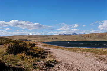 Fototapeta na wymiar The road along the shore of sacred Lake Manasarovar (4557m above sea level) in Western Tibet.