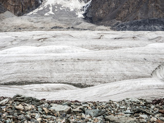 Glacier ice white texture with stones and rocks