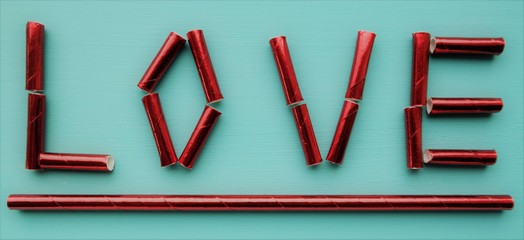 valentines day, made with red straws and turquoise background