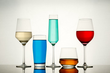 drinks in various alcoholic glasses