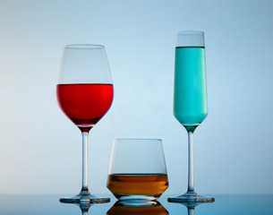 drinks in various alcoholic glasses