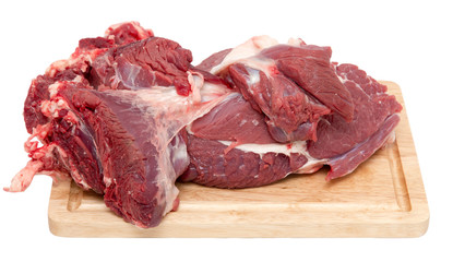 meat on a board on a white background