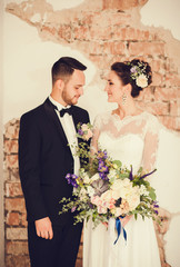 Elegant bride and groom posing together on a wedding day