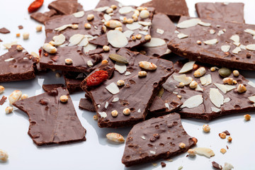 Variety of sweet homemade chocolate pralines on wooden background