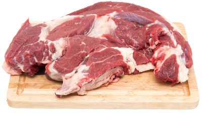 meat on a board on a white background