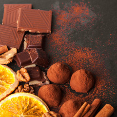 Variety of sweet homemade chocolate pralines on black background