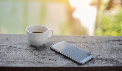 Cup of coffee with beautiful Latte art on wood table in cafe.