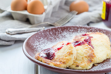 Delicious Homemade Fritters of Cottage Sheese with Raspberry Jam, Close Up View