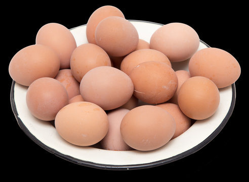 boiled eggs in a bowl on a black background