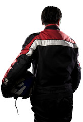 Man wearing a protective leather and textile racing suit for race cars and motorcycle motor sports.  The gear is armored with a helmet and worn by bikers and professional drivers. © Innovated Captures