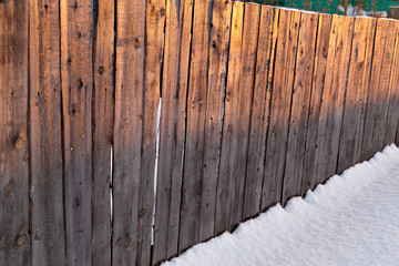 Wooden fence in the rising morning sun