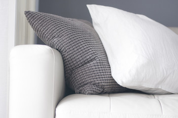 Detail shot sofa with white and grey pillow