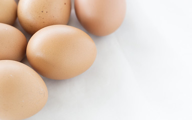 eggs on white cloth soft-focus and over light in the background