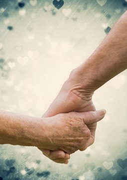 Hand of senior couple holding hands