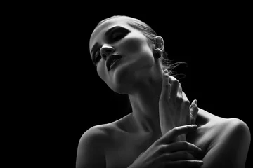 Foto op Plexiglas happy luxury woman model with professional makeup on black background monochrome © tugolukof