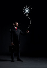 Businessman over black background. Business and office concept.